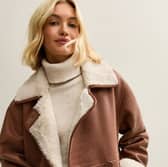 The New Look Brown Contrast Trim Bonded Jacket is the ultimate autumn essential for pumpkin picking 