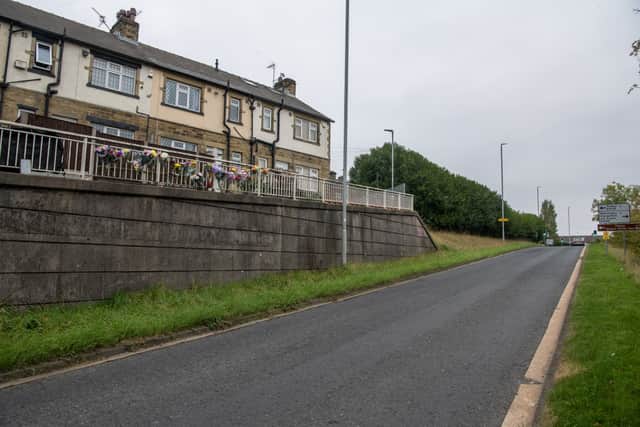 Tributes line the railings on Laurel Terrace overlooking Stanningley Bypass.