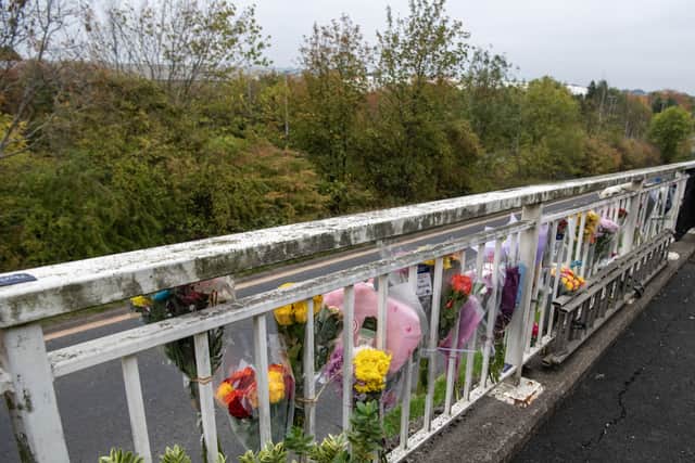 Floral tributes in memory of Danielle Smith have been attached to railings on Laurel Terrace.