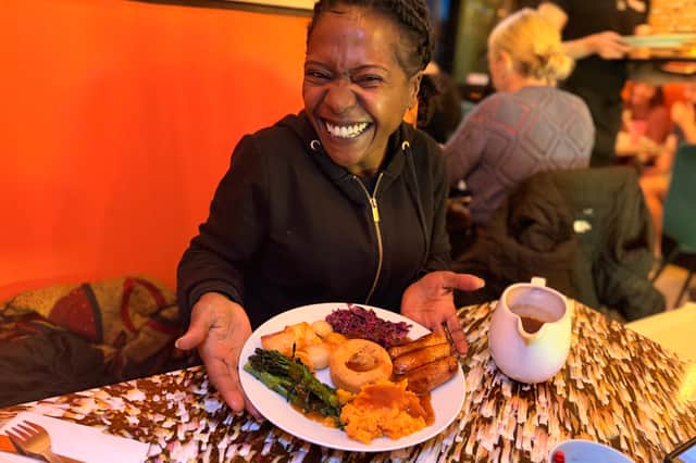 Indira Mwale eating a gluten-free Vegan Sunday Dinner