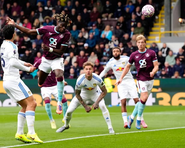 FREE AS A BIRD: Lesley Ugochukwu heads Burnley infront as Leeds United's defenders look on.