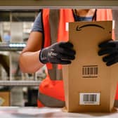 An Amazon employee prepares an order. The company is hiring over 15,000 seasonal workers across the UK ahead of the festive rush (Photo: SEBASTIEN BOZON/AFP via Getty Images)