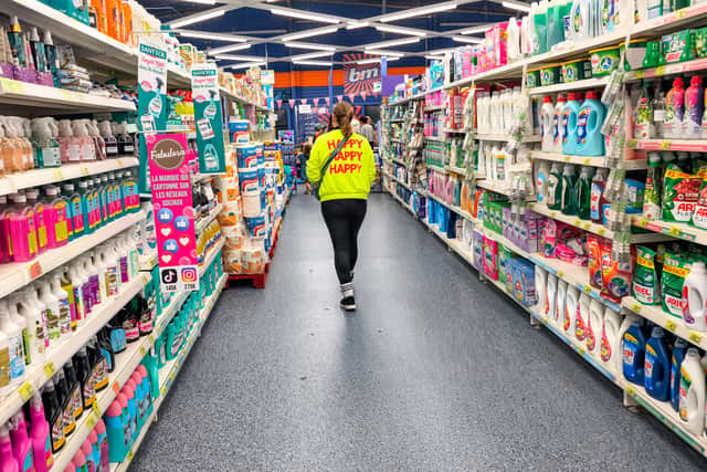 A woman walks in a section of cleaning products in a store of B&M. The retailer has revealed a £7 million accounting error caused by a system upgrade earlier this year (Photo: NICOLAS GUYONNET/Hans Lucas/AFP via Getty Images)