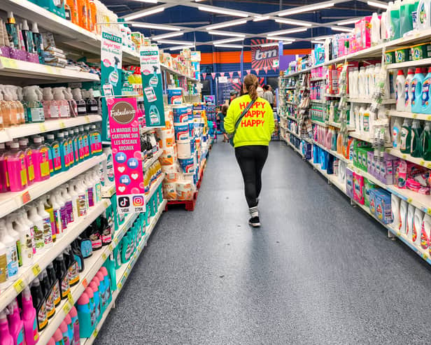 A woman walks in a section of cleaning products in a store of B&M. The retailer has revealed a £7 million accounting error caused by a system upgrade earlier this year (Photo: NICOLAS GUYONNET/Hans Lucas/AFP via Getty Images)          