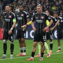 BLITZ: For ex-Leeds United pair Robin Koch, left, and Rasmus Kristensen, centre, with Eintracht Frankfurt against Liverpool.