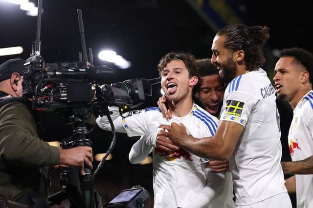Brenden Aaronson celebrates scoring for Leeds United.
