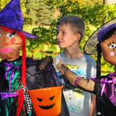 Lucas Smith, 10, from Horsforth meets up with scarecrows.