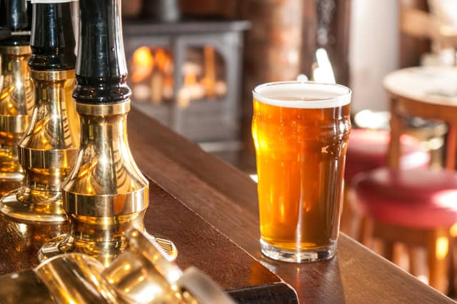 A freshly pulled pint and a roaring fire – the kind of welcome you can expect at many Green King pubs this winter