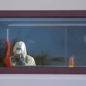 A forensic investigator photographing the scene on the LNER train that was bound for London.