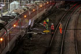 Emergency responder on the tracks by the train at Huntingdon station in Cambridgeshire, after a number of people were stabbed. 
