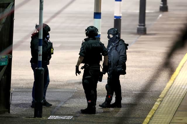 British Transport Police emergency responders on the platform by the train at Huntingdon station in Cambridgeshire, after a number of people were stabbed. Two p