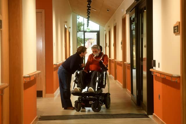 MND Patient Ian Flatt is pictured with his wife Rachael Flatt at the centre.