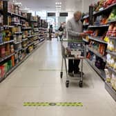 A man shops at a Waitrose supermarket in London. The supermarket has launched its new Little Treats rewards nationwide for My Waitrose members (Photo: HOLLIE ADAMS/AFP via Getty Images)