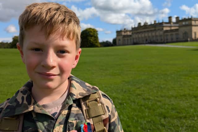 Eight-year-old Dexter has walked 28.2 miles to support both the Poppy Appeal and his football team