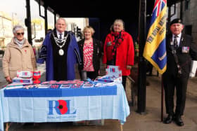 Shirley Ramsden has been presented with the first poppy,  in memory of her son Lance Corporal David Ramsden, as the Otley branch of the Royal British Legion opened its annual Remembrance fundraising