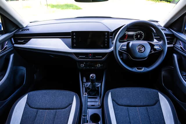 The two-spoke steering wheel almost looks out of place in such a conventional cabin - but we can allow the odd little quirk
