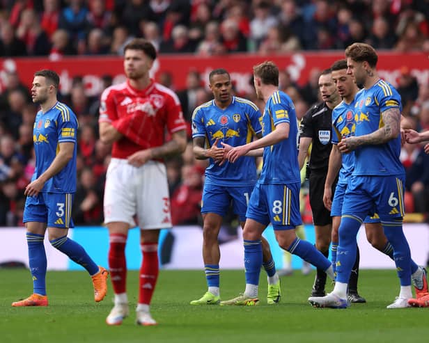 Leeds United players celebrate after Lukas Nmecha's goal.