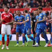 Leeds United players celebrate after Lukas Nmecha's goal.