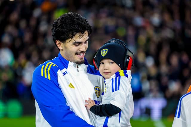 Reggie during treatment carried by Leeds United player Pascal Struijk