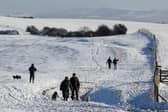 Walkers enjoy the snow at Ditchling Beacon in January 2025. Met Office snow and ice warnings are predicting dangerous travel conditions across the UK (Photo: Dan Kitwood/Getty Images)