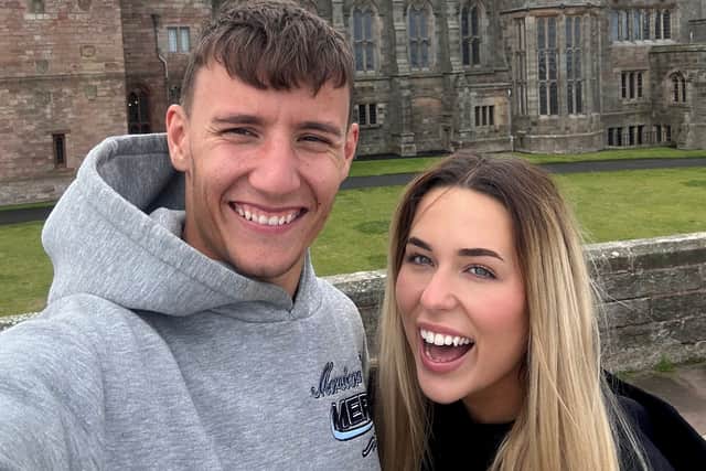 Jenson Smith with his girlfriend.An electrician has his "best friend" and family dog help him out by retrieving tools whilst he is working