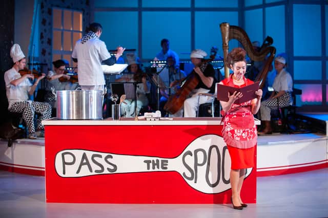A scene from David Shrigley’s surreal 'sort-of-opera' Pass the Spoon, where the cast and orchestra perform on a brightly lit kitchen set. The unconventional culinary show runs at Opera North’s Howard Assembly Room in Leeds this December.