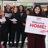 The Love Actually star joined a special welcoming committee at London’s Stansted Airport. 