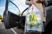 A customer places Morrisons shopping bags in their car. The supermarket is undergoing a major restructure in 2025, with almost 150 closures nationwide (Photo: Rob Stothard/Getty Images)