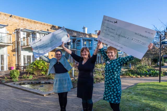 Kate Bratt-Farrar, hospice director, for Sue Ryder Wheatfield Hospice, left, and Kerry Jackson, chief executive at St Gemma's Hospice, right, receive a cheque from YEP editor Hannah Thaxter.