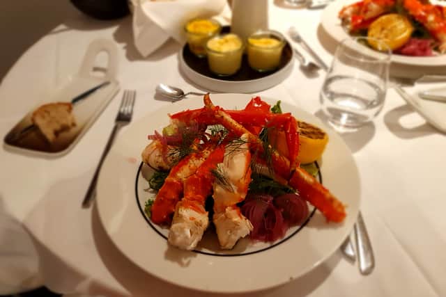 Enjoying the delicacy of Norwegian king crab at the fine-dining Krysten restaurant on board Hurtigruten's MS Nordlys