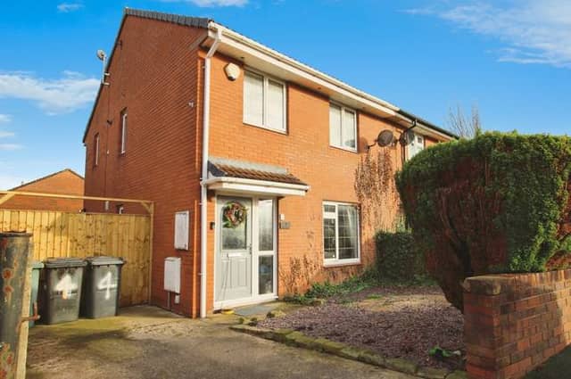 The property has driveway parking and low-maintenance gardens