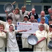 Some of the members of the Benton Park School lottery syndicate, pictured with their cheque for £138,153 in March 1998. Holding the cheque, centre, is lottery leader Christine Lawrence.