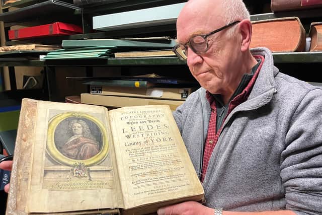 Library and digital assistant Phil Wilde holding the Ducatus.