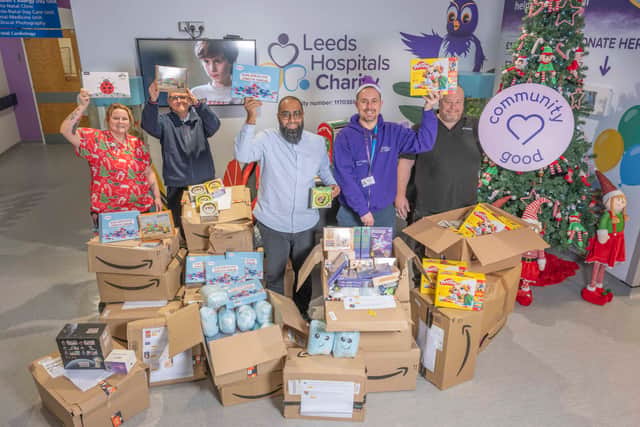 Mubs Mahmed (centre) with Kevin McKenna, Mick Forbes (right) and (rear) Clare from the charity and First Bus driver Chris Munden