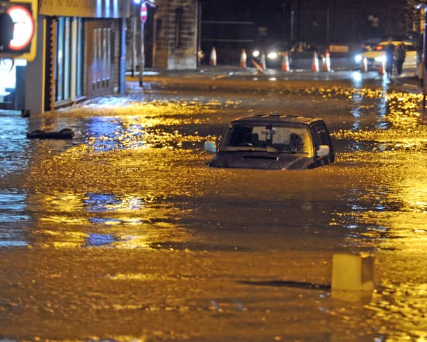 Cars under flood water at Viaduct Road Kirkstall Road in Leeds after the River Aire burst its banks. 