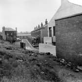 Back Easy Road, seen in the centre of the image, taken from an area known locally as 'the quarry'. The white building is the rear of East Leeds Working Men's Club at number 81 Easy Road. Pictured in July 1951.