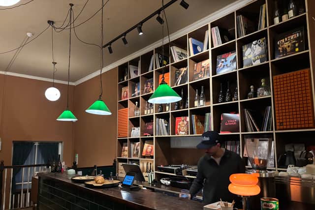 The bar is stocked with records, beers on tap, and wine.
