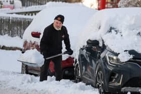 A man shovels snow as an 'amber' snow warning was issued on January 2 in Scotland. Cold Weather Payments offer £25 support during prolonged periods of freezing weather (Photo: Jeff J Mitchell/Getty Images)