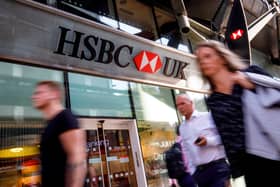 Pedestrians walk past a HSBC UK bank branch in central London. The bank is offering up to £750 in cashback to customers who switch in 2026 (Photo: TOLGA AKMEN/AFP via Getty Images)