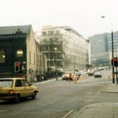 Calverley Street showing the junction with Alexander Street on the right. Just beyond this, the edge of the Education Offices can be seen. In the background are the Brotherton Wing of Leeds General Infirmary and buildings of Leeds Polytechnic.