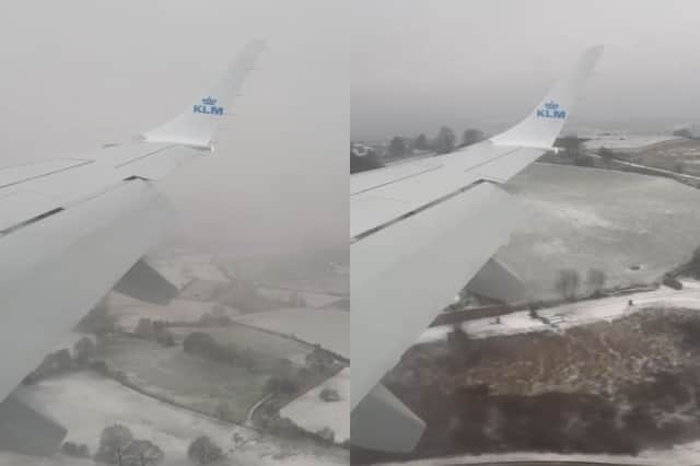 A plane flies over snowy Leeds as it comes into land at Leeds Bradford Airport on January 11 2026.