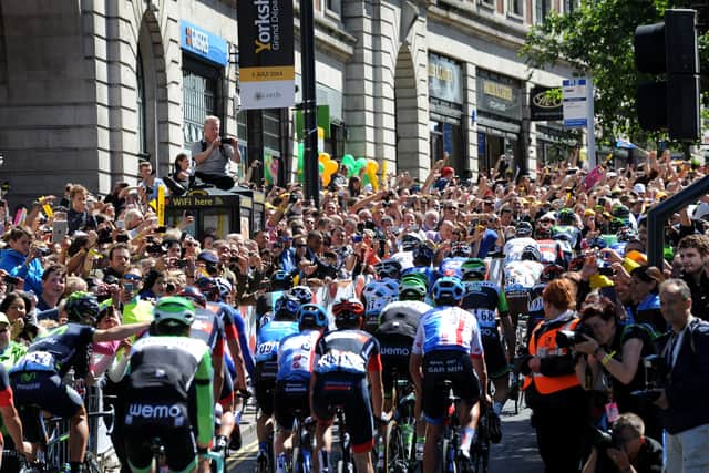 Crowds line the Headrow at the start at the first stage of the Tour de France in in Leeds.
