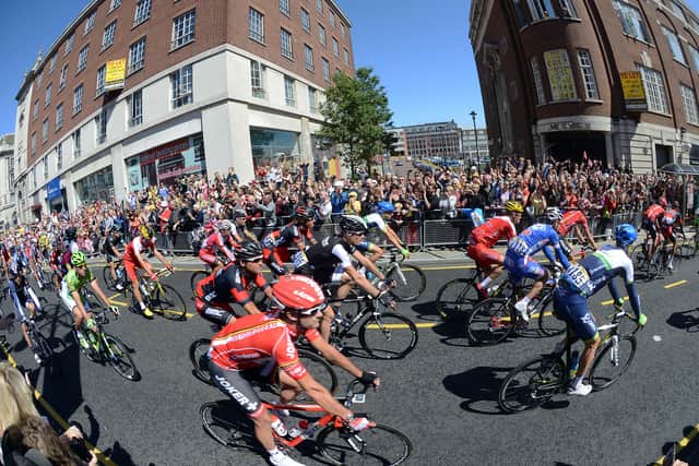 The cyclists head down the Headrow at the start of the Tour De France.
