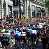 The riders make their way up The Headrow.