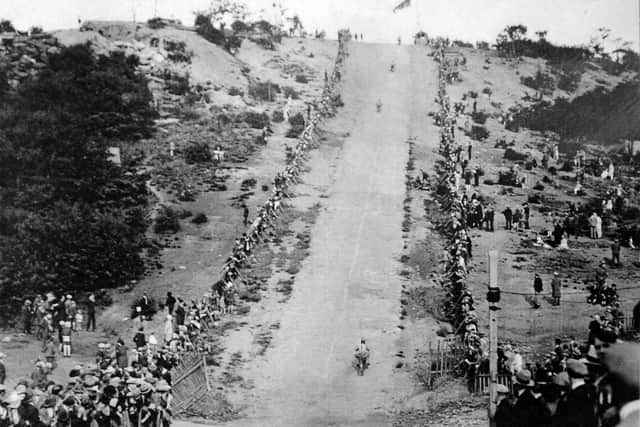 Motorcyclists tackle the hill climb.