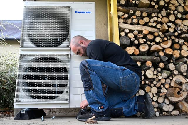 Homeowners can now access low- and zero-interest loans for solar panels, heat pumps, and batteries (Photo: DAMIEN MEYER/AFP via Getty Images)