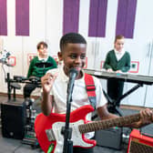 Local schoolchildren are picking up instruments as part of an in-school programme to promote music - and, in response, absence figures have dropped. 