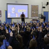 Zack George talks to pupils.