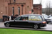 The hearse arrives before the funeral service for Terry Yorath at the Immaculate Heart of Mary Catholic Church in Leeds.