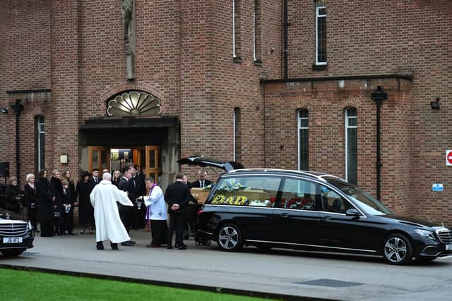 The casket is carried from the church following the funeral service for Terry Yorath at the Immaculate Heart of Mary Catholic Church in Moortown.